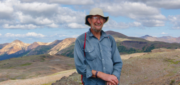 Dave standing in front of the Rainbow Range.